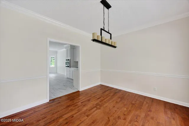 a view of a hallway with a wooden floor