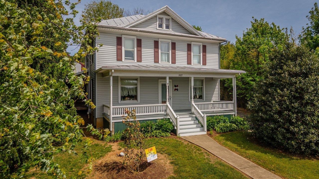 front view of a house with a yard