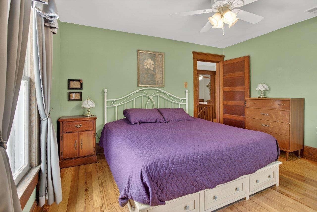 107 Timber Way Broadway, VA 22815 - Photo 31 of 73 a bedroom with a bed and a chandelier