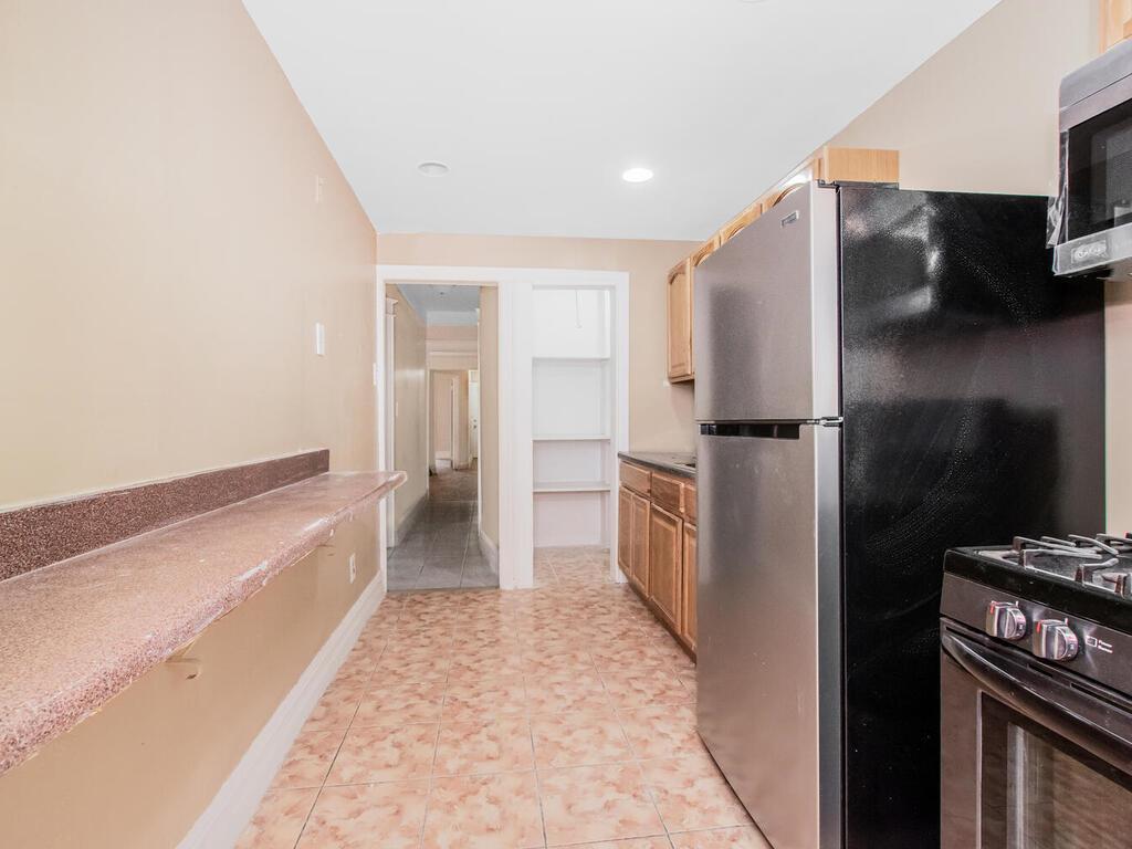 3357 Perry Avenue Bronx, NY 10467 - Photo 13 of 31 Kitchen featuring light tile patterned floors, stainless steel appliances, baseboards, and recessed lighting