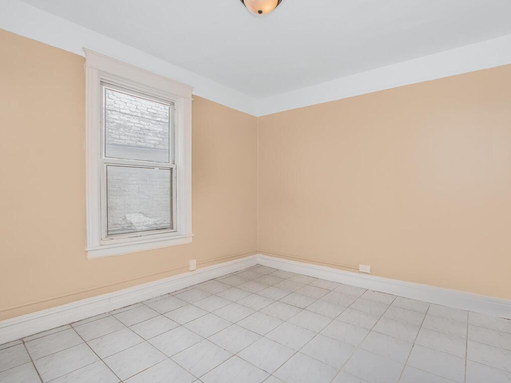 3357 Perry Avenue Bronx, NY 10467 - Photo 16 of 31 Spare room with baseboards