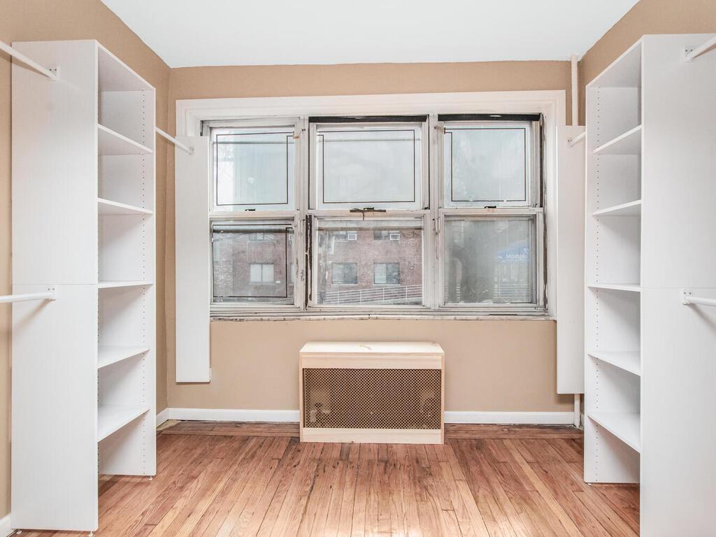 3357 Perry Avenue Bronx, NY 10467 - Photo 20 of 31 Spacious closet featuring wood-type flooring and heating unit
