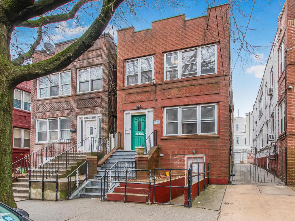 3357 Perry Avenue Bronx, NY 10467 - Photo 31 of 31 View of front of home with brick siding and a gate