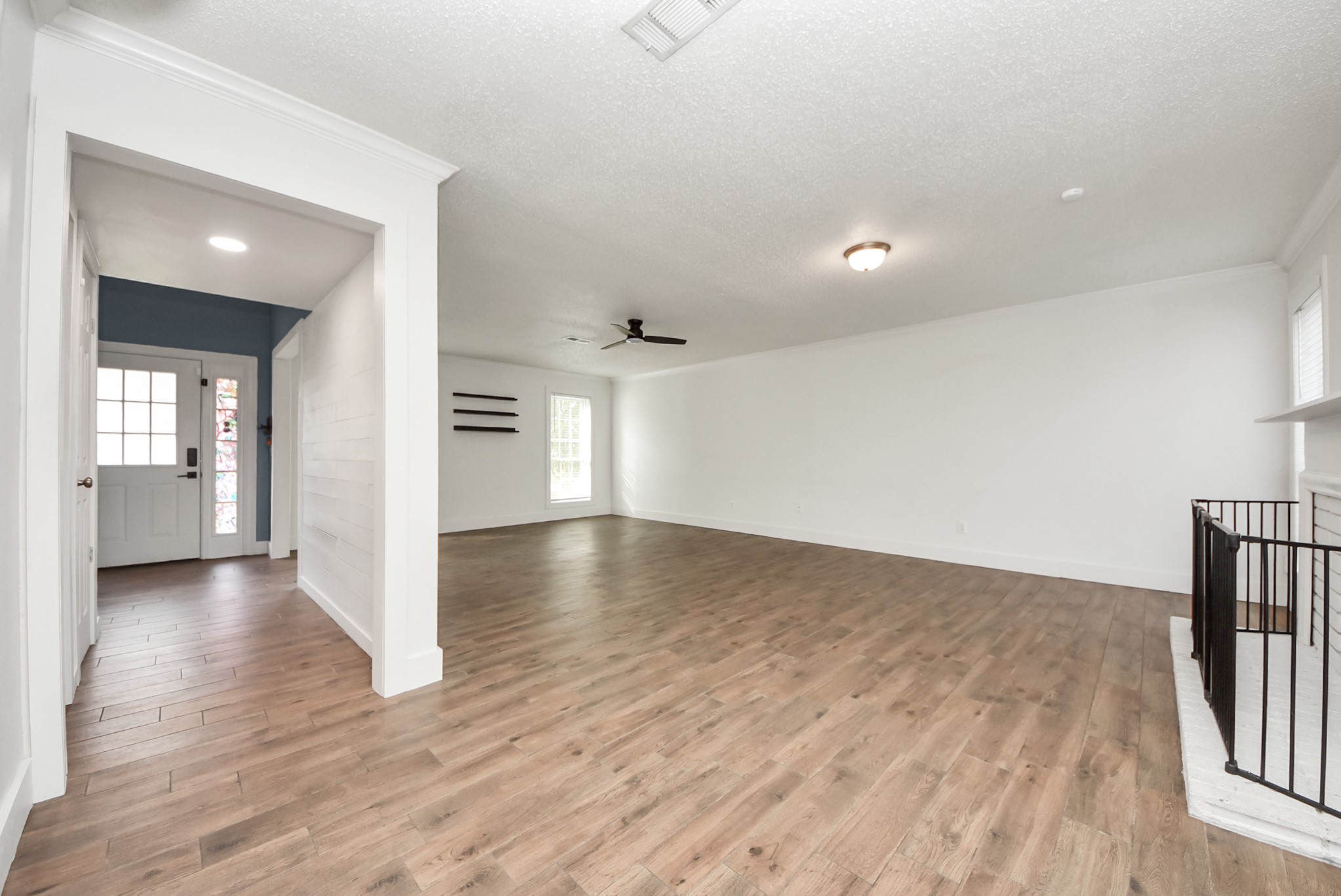 12614 Mill Ridge Drive Cypress, TX 77429 - Photo 11 of 44 wooden floor in an empty room with a window