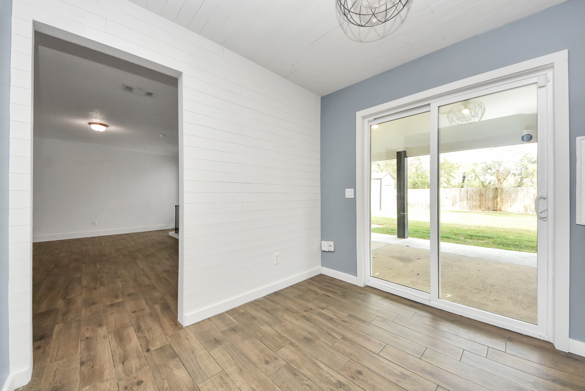 12614 Mill Ridge Drive Cypress, TX 77429 - Photo 12 of 44 a view of an empty room with wooden floor and a window