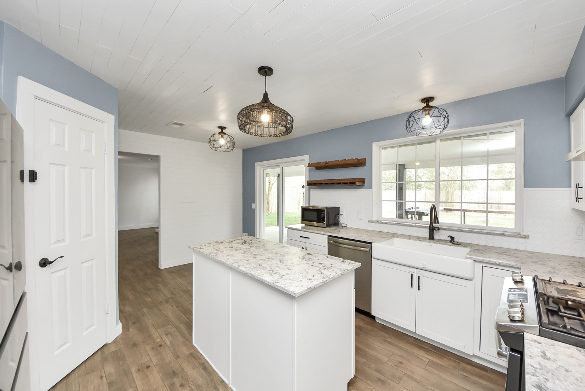12614 Mill Ridge Drive Cypress, TX 77429 - Photo 14 of 44 a kitchen with a sink stove and cabinets