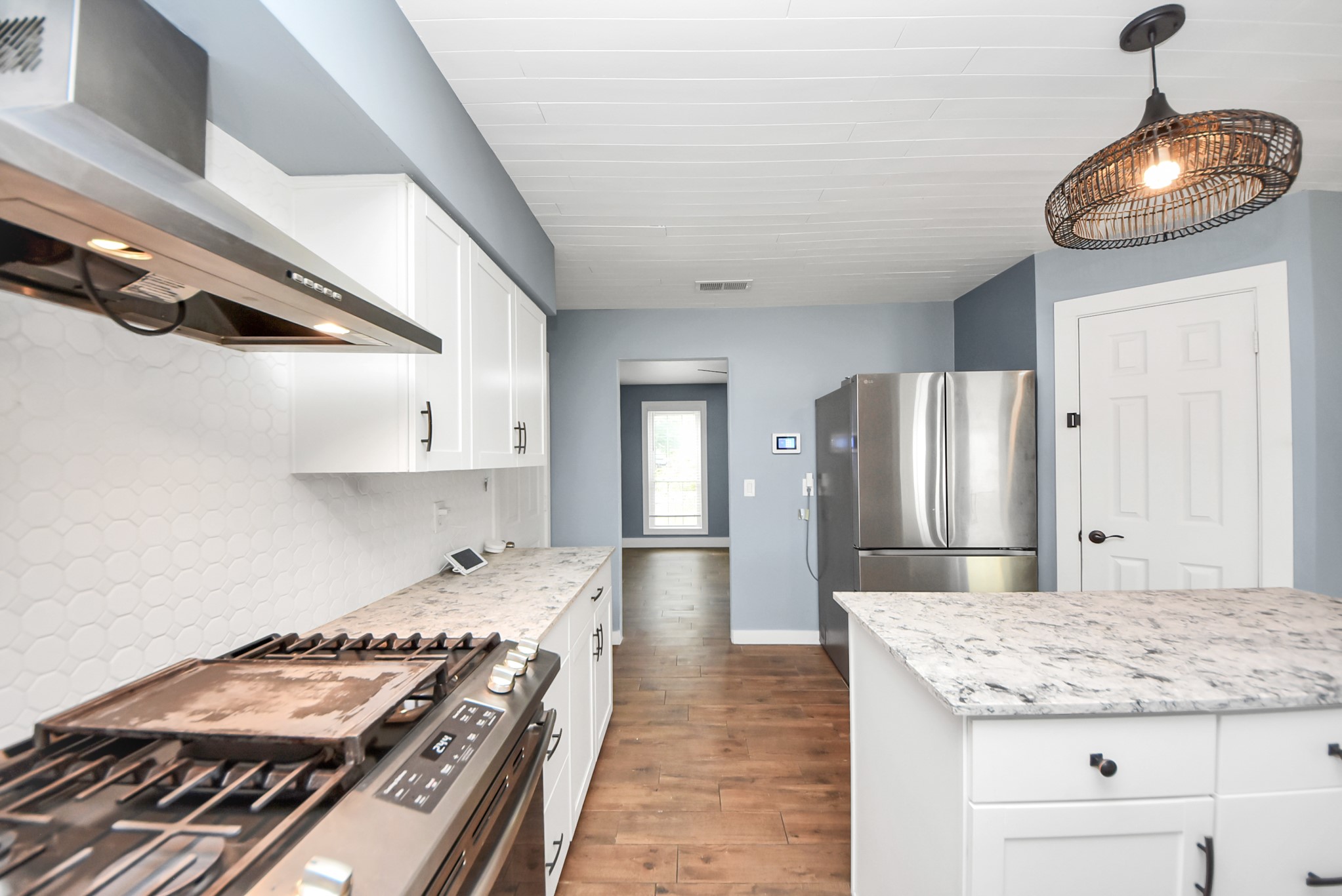 12614 Mill Ridge Drive Cypress, TX 77429 - Photo 16 of 44 a kitchen with stainless steel appliances granite countertop a stove and a refrigerator