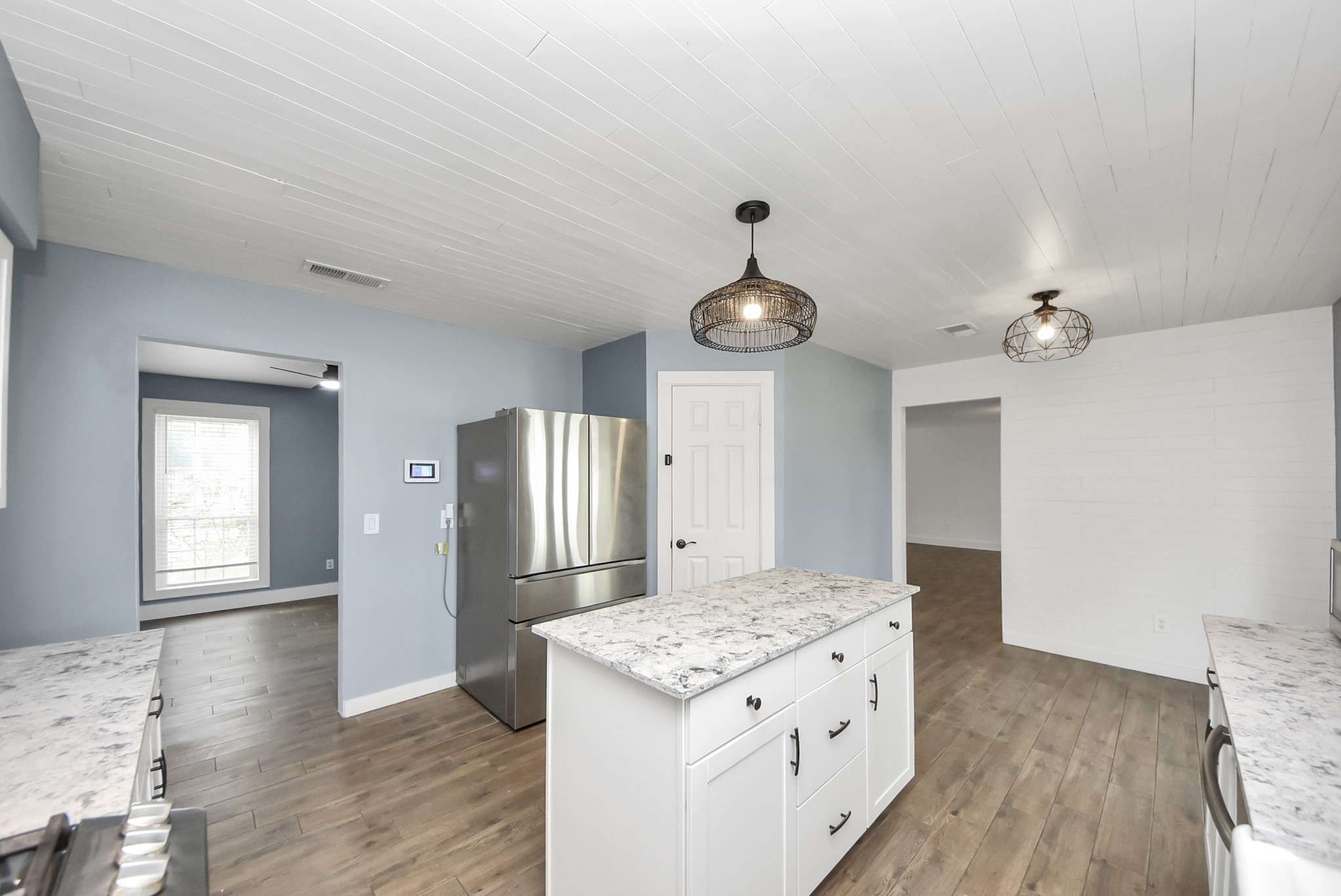 12614 Mill Ridge Drive Cypress, TX 77429 - Photo 17 of 44 a kitchen with a stove and wooden floor