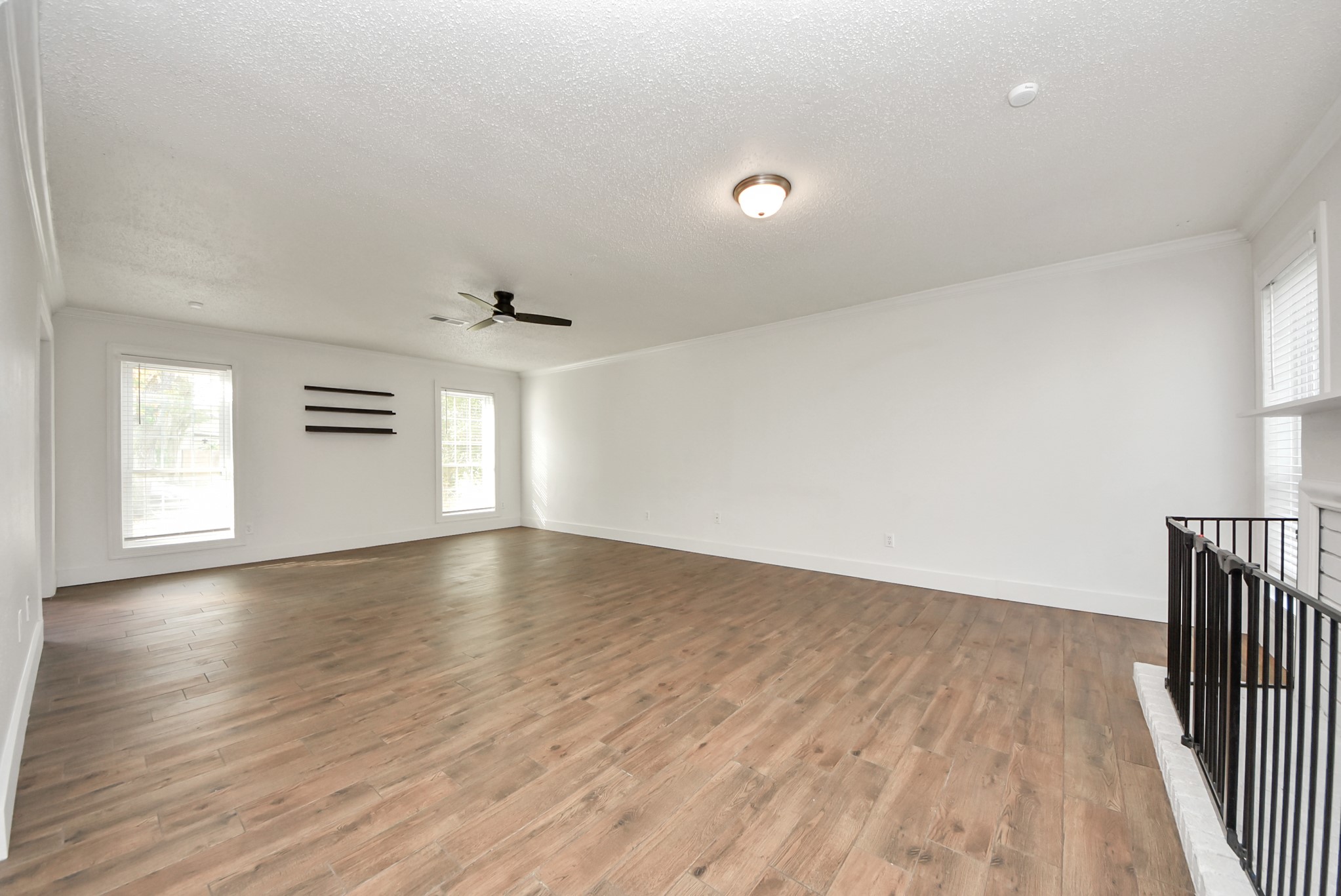 12614 Mill Ridge Drive Cypress, TX 77429 - Photo 22 of 44 an empty room with wooden floor and windows