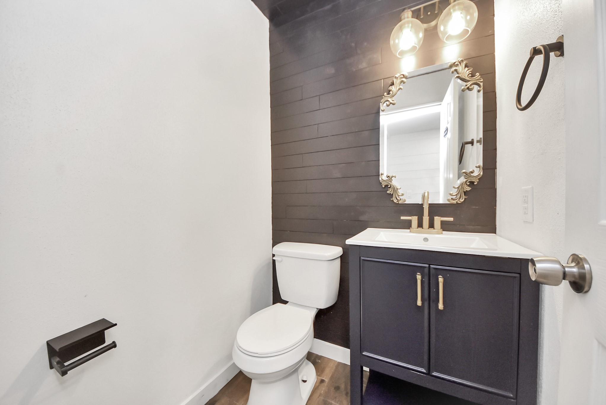 12614 Mill Ridge Drive Cypress, TX 77429 - Photo 24 of 44 a bathroom with a toilet sink and mirror