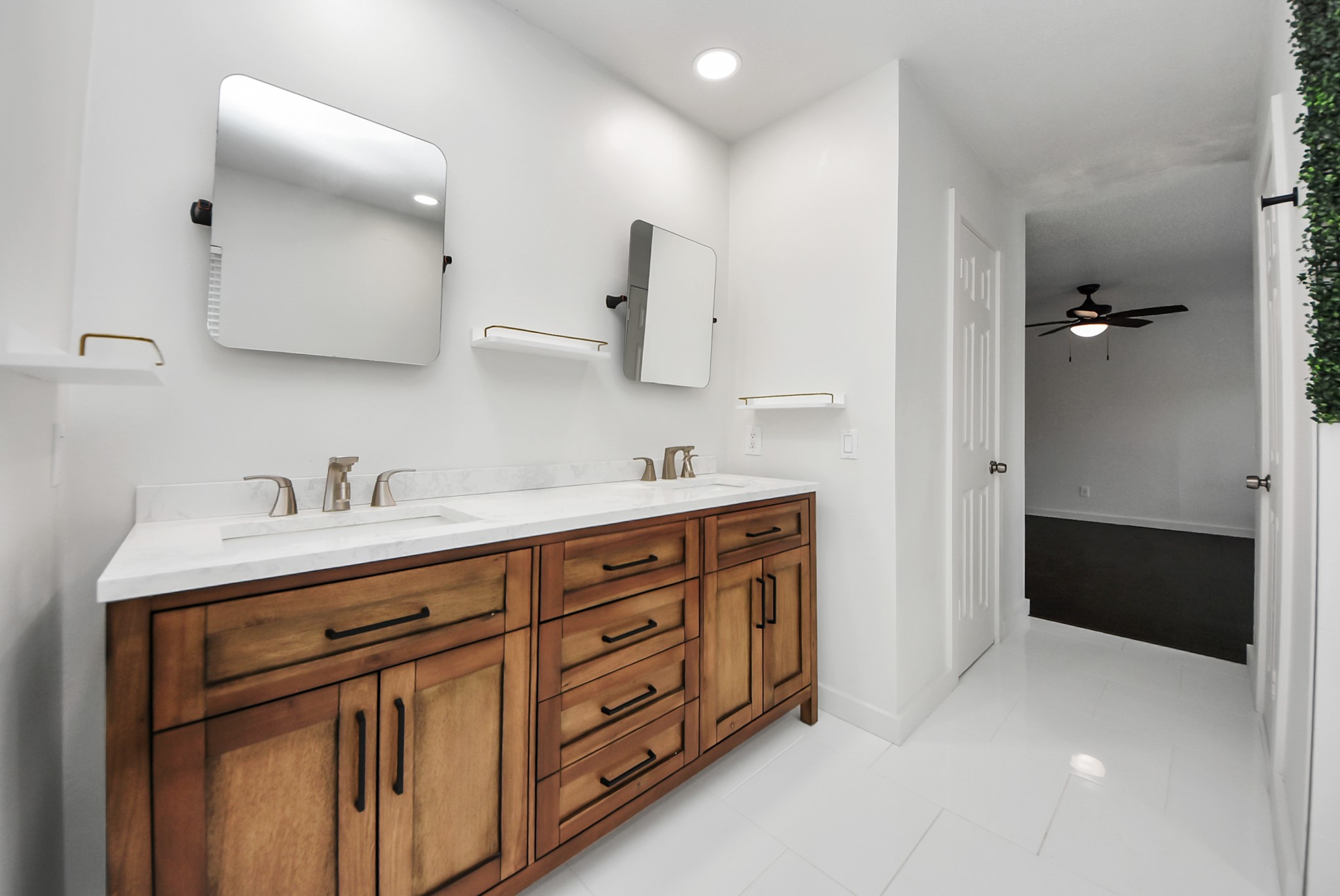 12614 Mill Ridge Drive Cypress, TX 77429 - Photo 32 of 44 a spacious bathroom with a double vanity sink a mirror and a bathtub