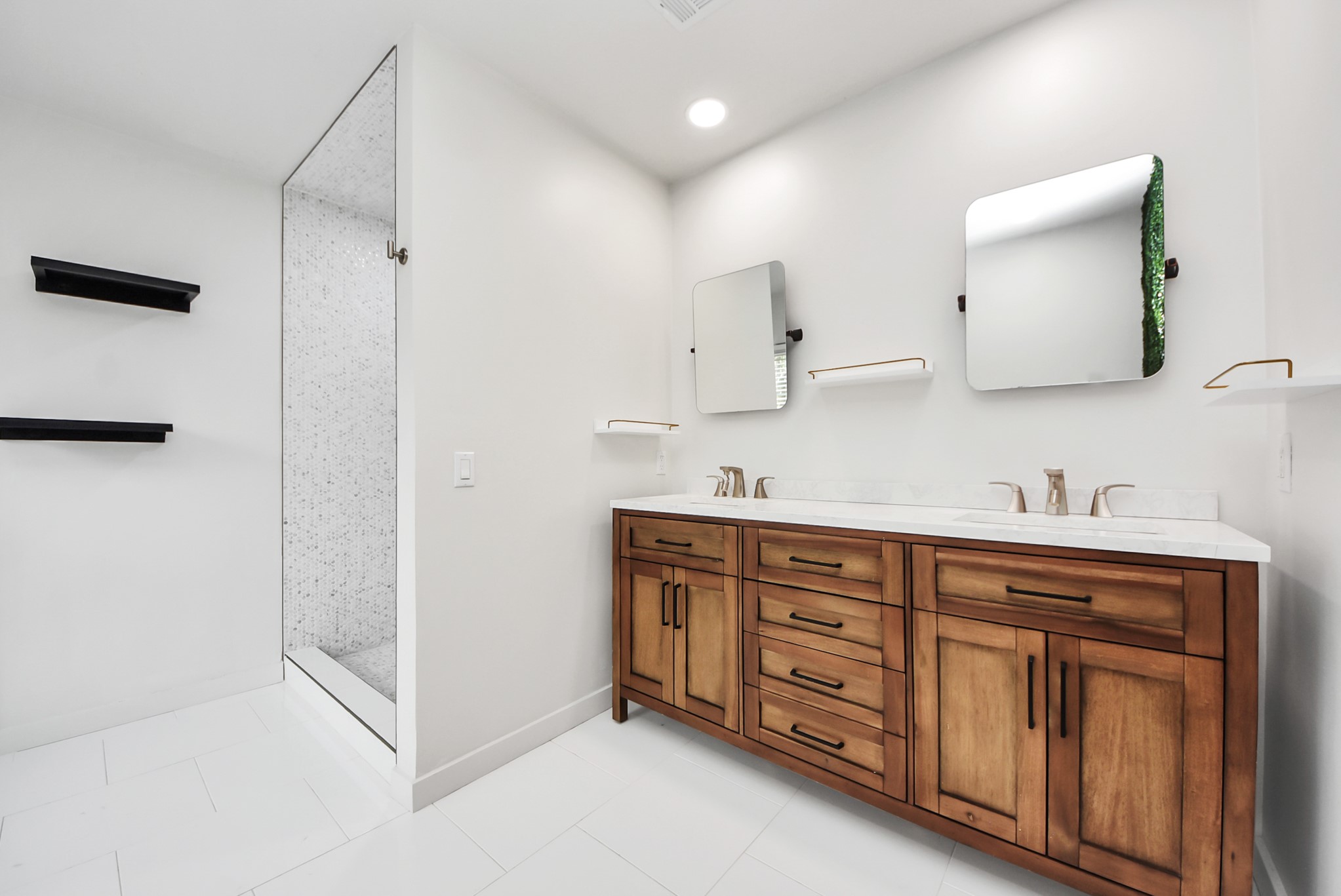 12614 Mill Ridge Drive Cypress, TX 77429 - Photo 33 of 44 a spacious bathroom with a double vanity sink a large mirror and shower