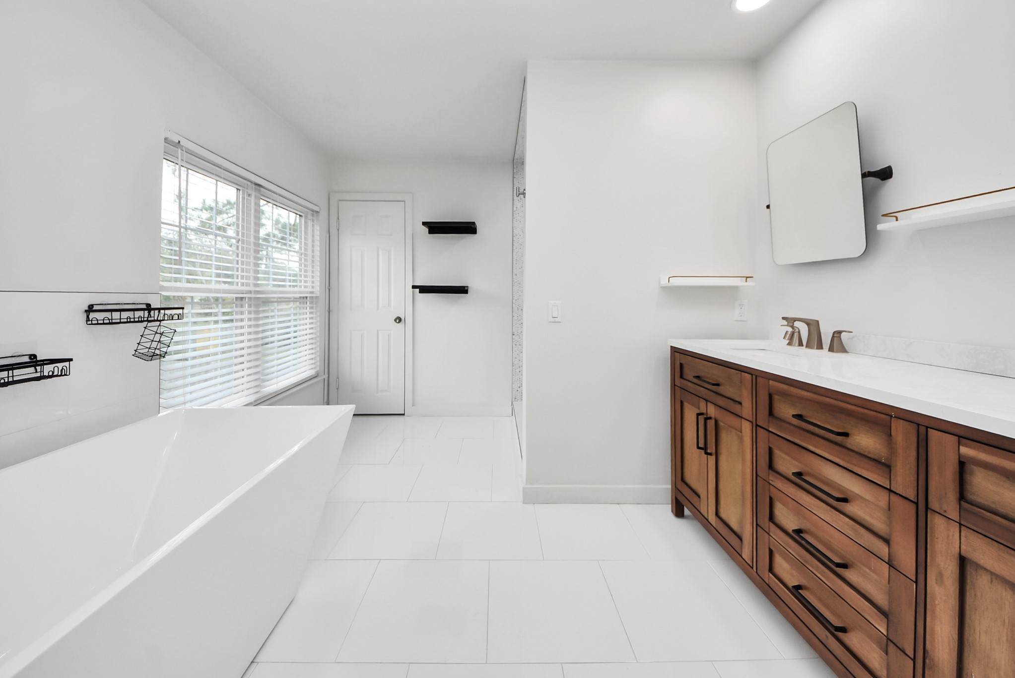 12614 Mill Ridge Drive Cypress, TX 77429 - Photo 34 of 44 a spacious bathroom with a tub sink and mirror