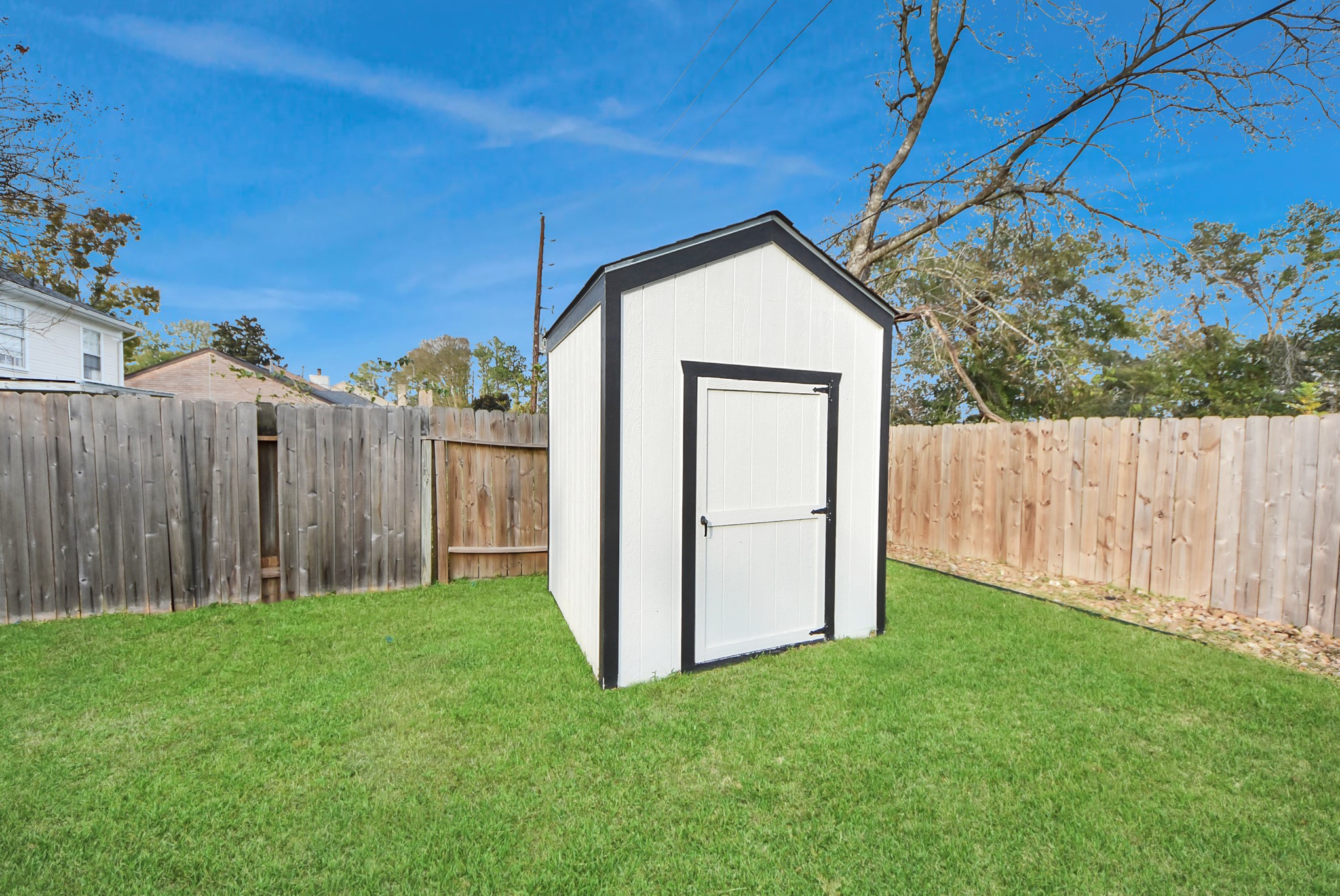12614 Mill Ridge Drive Cypress, TX 77429 - Photo 41 of 44 a view of backyard with barn and a cactus plant