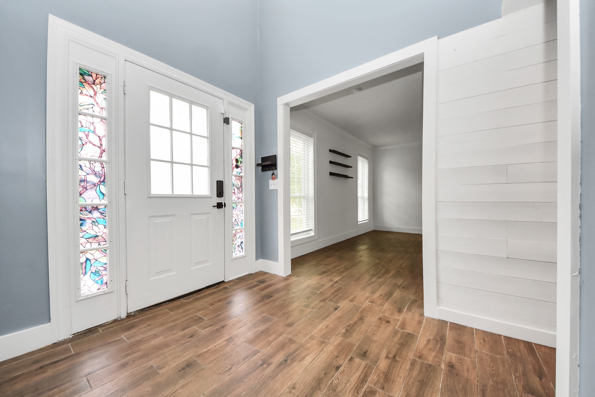 12614 Mill Ridge Drive Cypress, TX 77429 - Photo 5 of 44 an empty room with wooden floor cabinet and windows