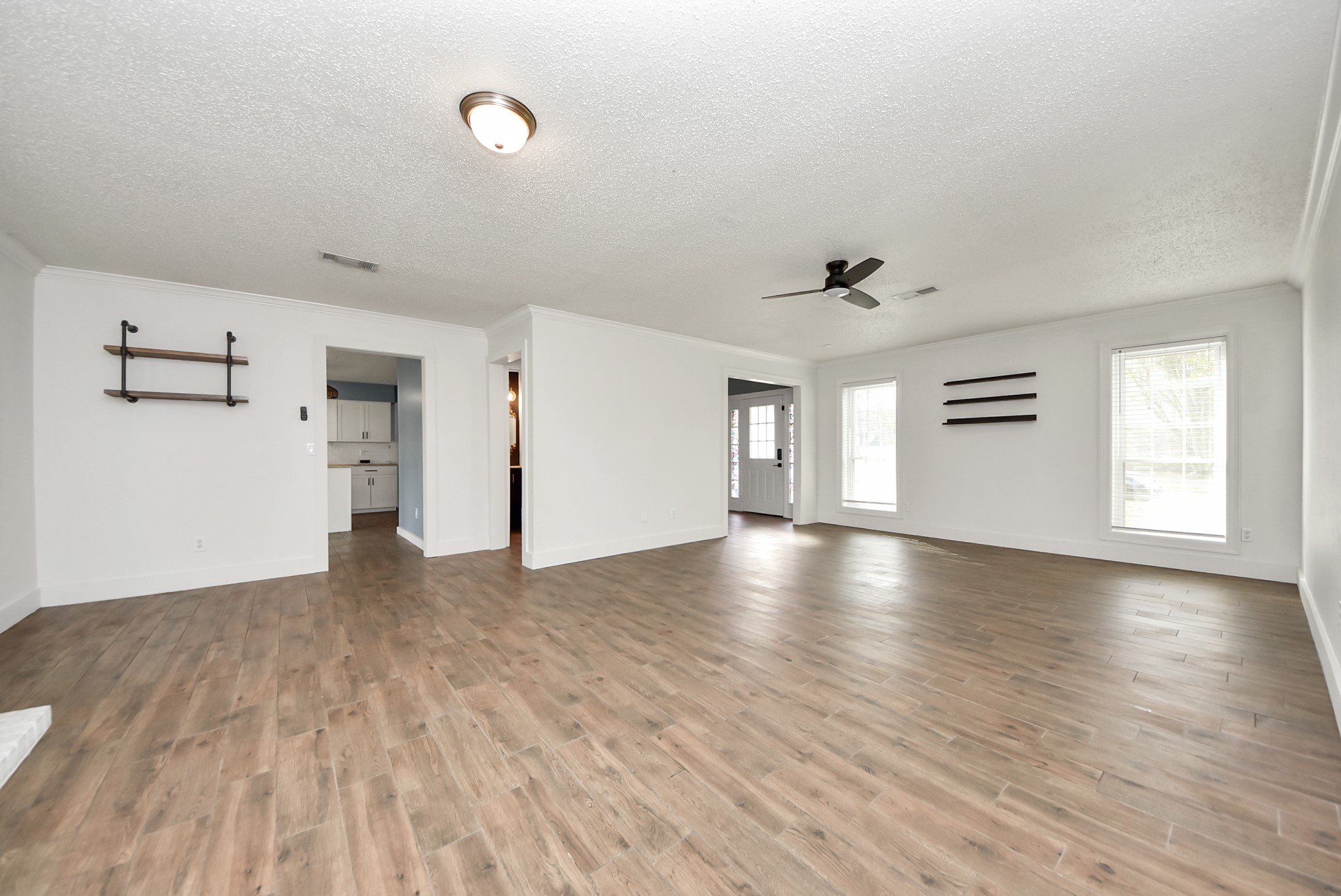 12614 Mill Ridge Drive Cypress, TX 77429 - Photo 10 of 44 a view of empty room with wooden floor and windows
