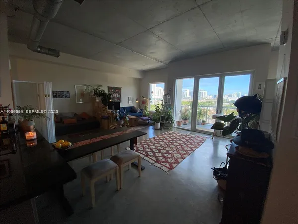 a kitchen with kitchen island a counter top space cabinets and stainless steel appliances