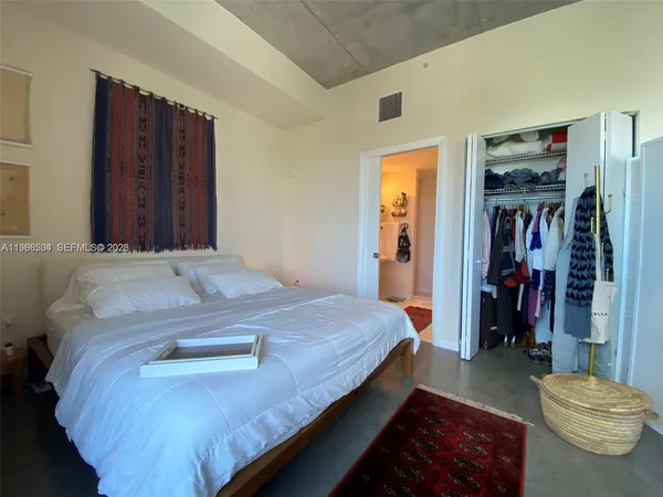 a view of a balcony with an outdoor seating