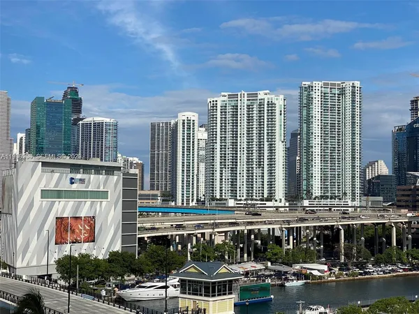a view of a city with large trees