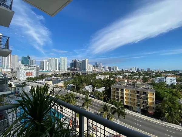 a building outdoor space with patio furniture and window