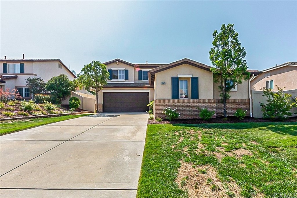 33847 Abbey Road Temecula, CA 92592 - Photo 1 of 1 a front view of a house with a yard and garage