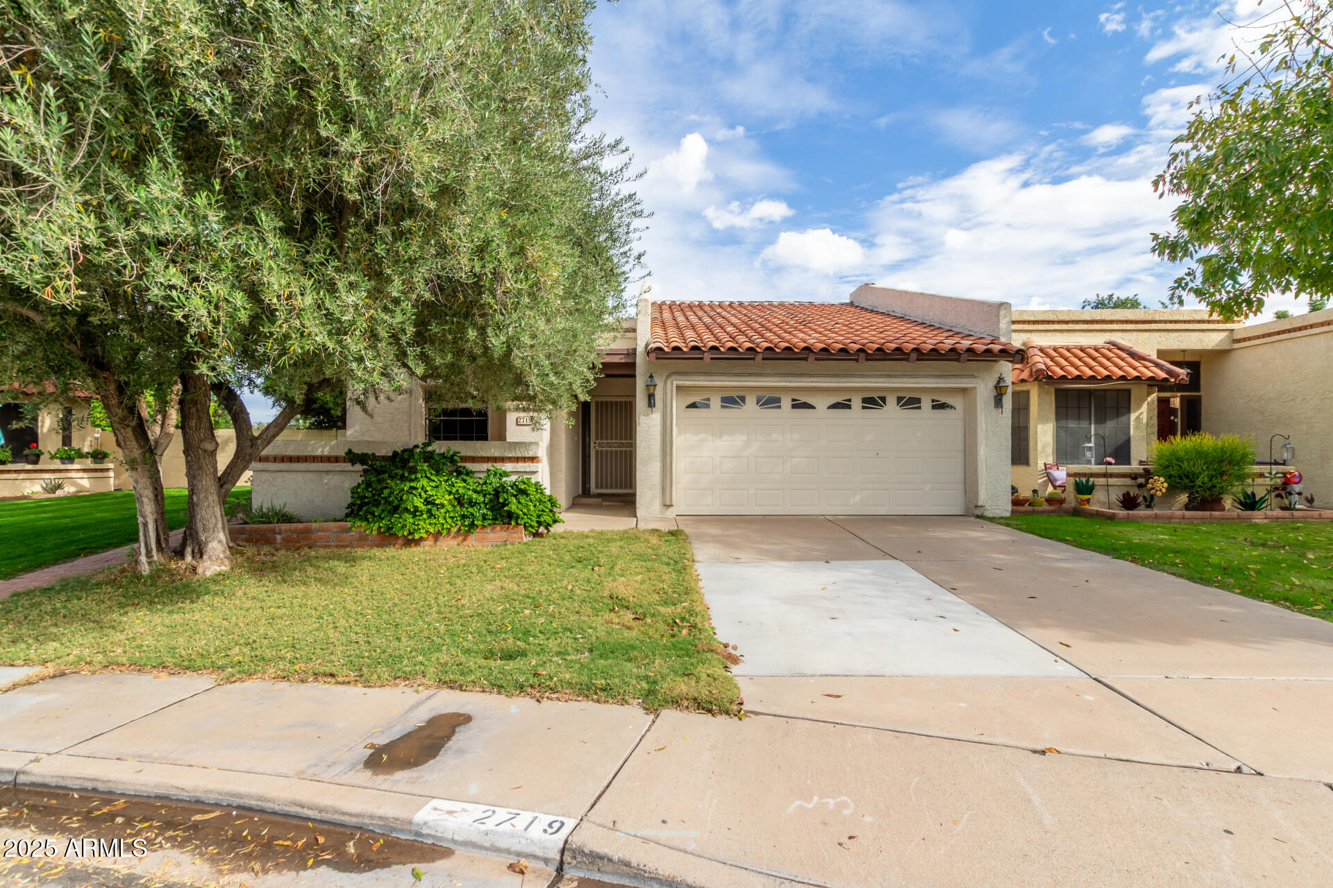 2719 South Santa Barbara Mesa, AZ 85202 - Photo 1 of 37 a front view of a house with a garden