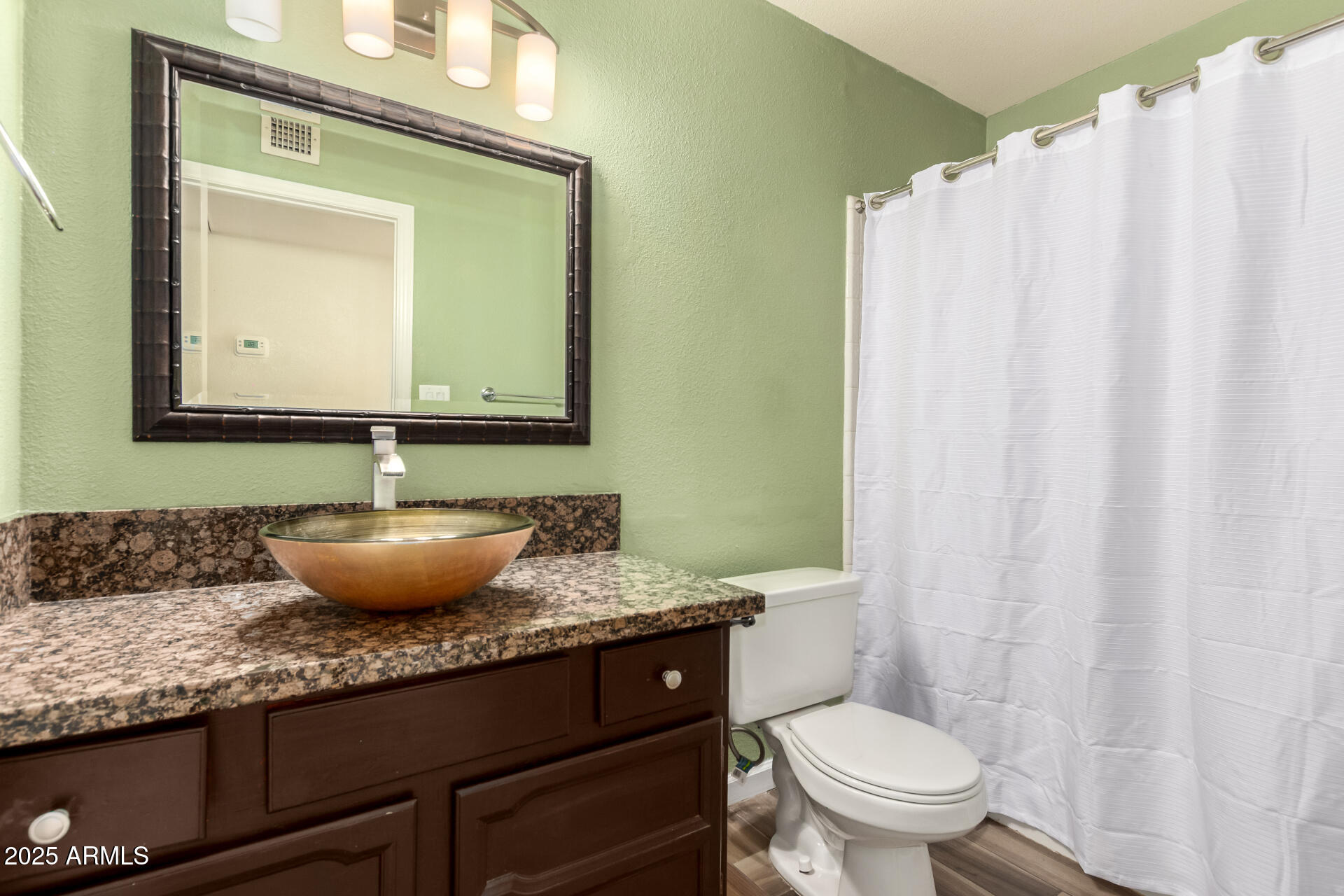 2719 South Santa Barbara Mesa, AZ 85202 - Photo 26 of 37 a bathroom with a granite countertop toilet sink and mirror