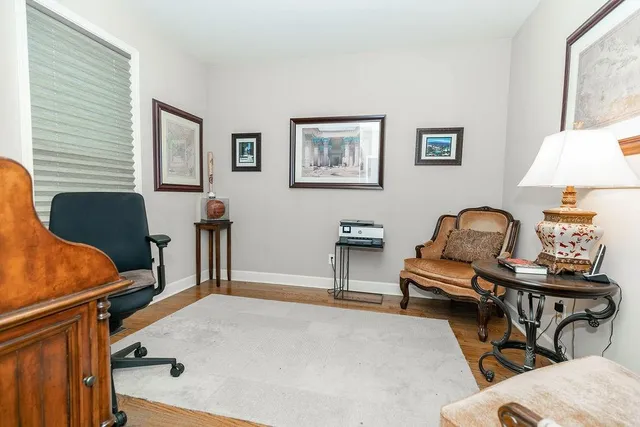 a living room with furniture and a lamp