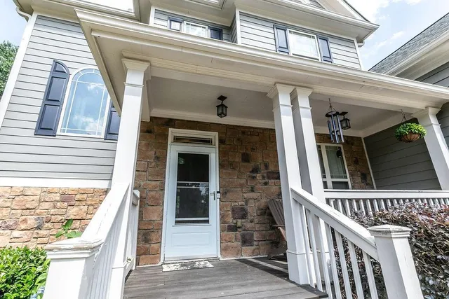 front view of a house with a large window