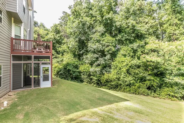 a view of a house with a yard and garage