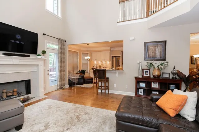 a living room with furniture fireplace and flat screen tv