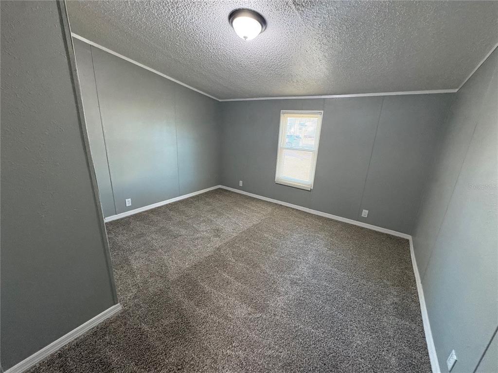 4680 Turner Road Mulberry, FL 33860 - Photo 11 of 26 an empty room with windows