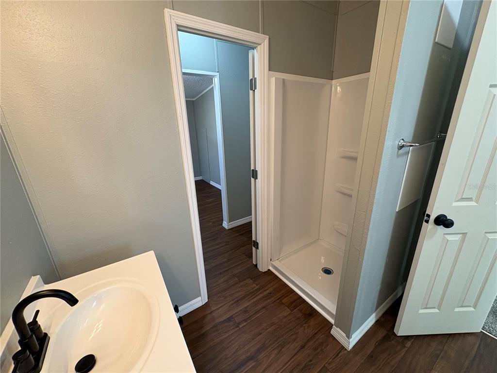 4680 Turner Road Mulberry, FL 33860 - Photo 7 of 26 a bathroom with a tub and shower