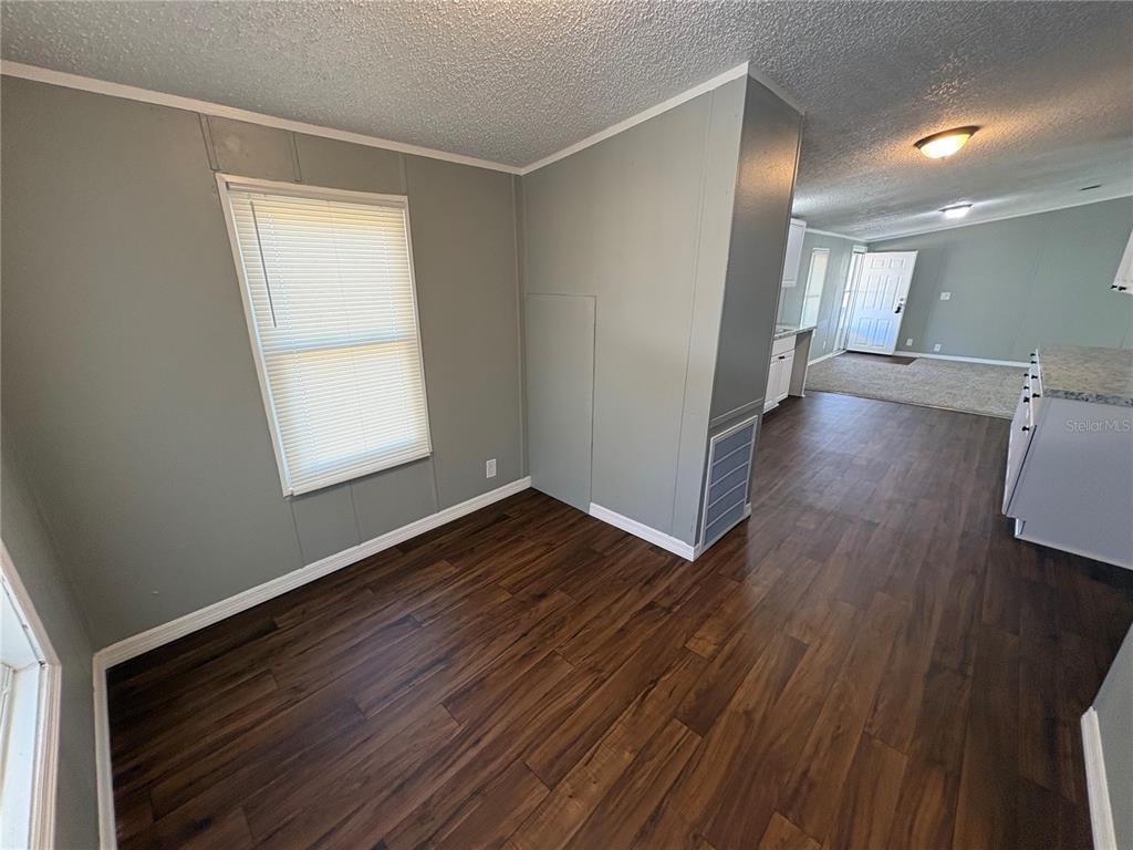 4680 Turner Road Mulberry, FL 33860 - Photo 9 of 26 wooden floor in an empty room with a window