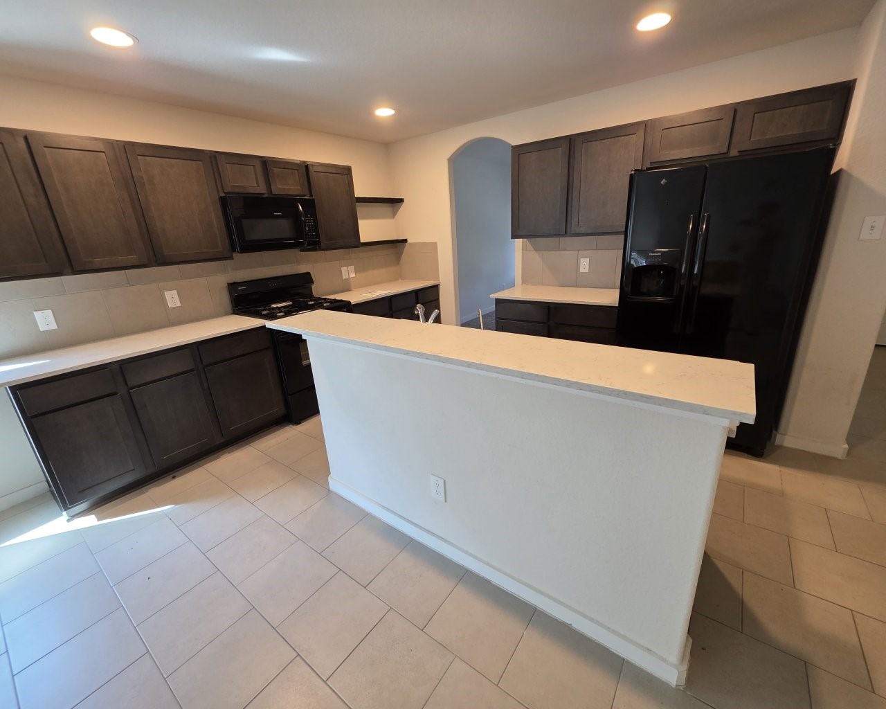 6807 Bardsdale Court Rosharon, TX 77583 - Photo 4 of 20 a kitchen with stainless steel appliances a refrigerator and a microwave