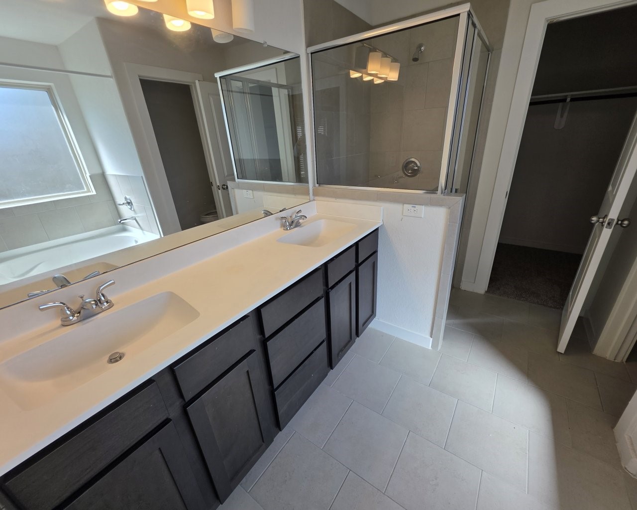 6807 Bardsdale Court Rosharon, TX 77583 - Photo 10 of 20 a bathroom with a double vanity sink and mirror