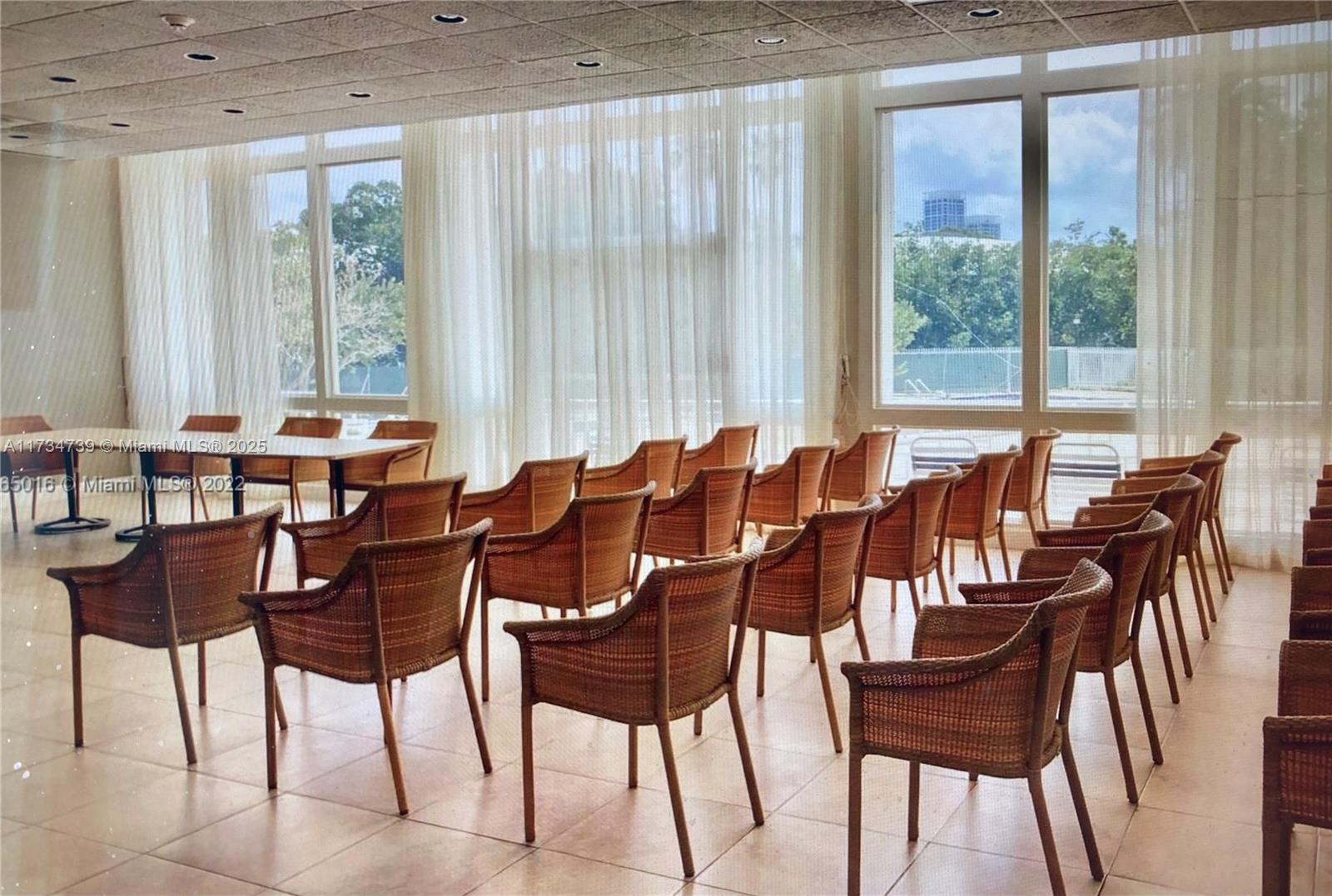 7441 Wayne Avenue, Unit 6B Miami Beach, FL 33141 - Photo 11 of 33 a view of a dining room with furniture and windows