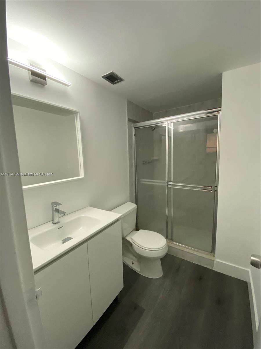 7441 Wayne Avenue, Unit 6B Miami Beach, FL 33141 - Photo 13 of 33 a bathroom with a sink toilet and shower