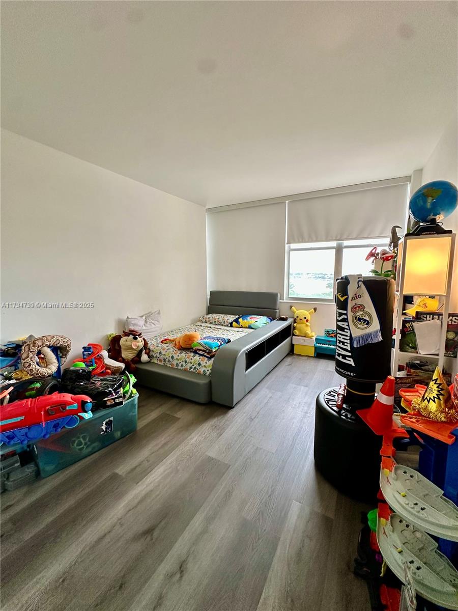 7441 Wayne Avenue, Unit 6B Miami Beach, FL 33141 - Photo 20 of 33 a bedroom with bed and a window