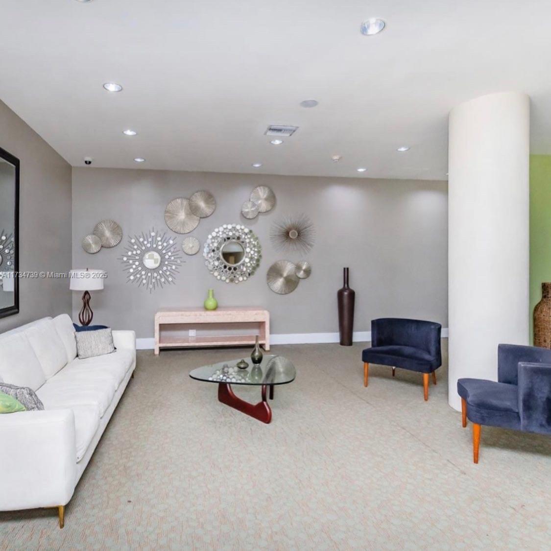 7441 Wayne Avenue, Unit 6B Miami Beach, FL 33141 - Photo 27 of 33 a living room with furniture and a couch