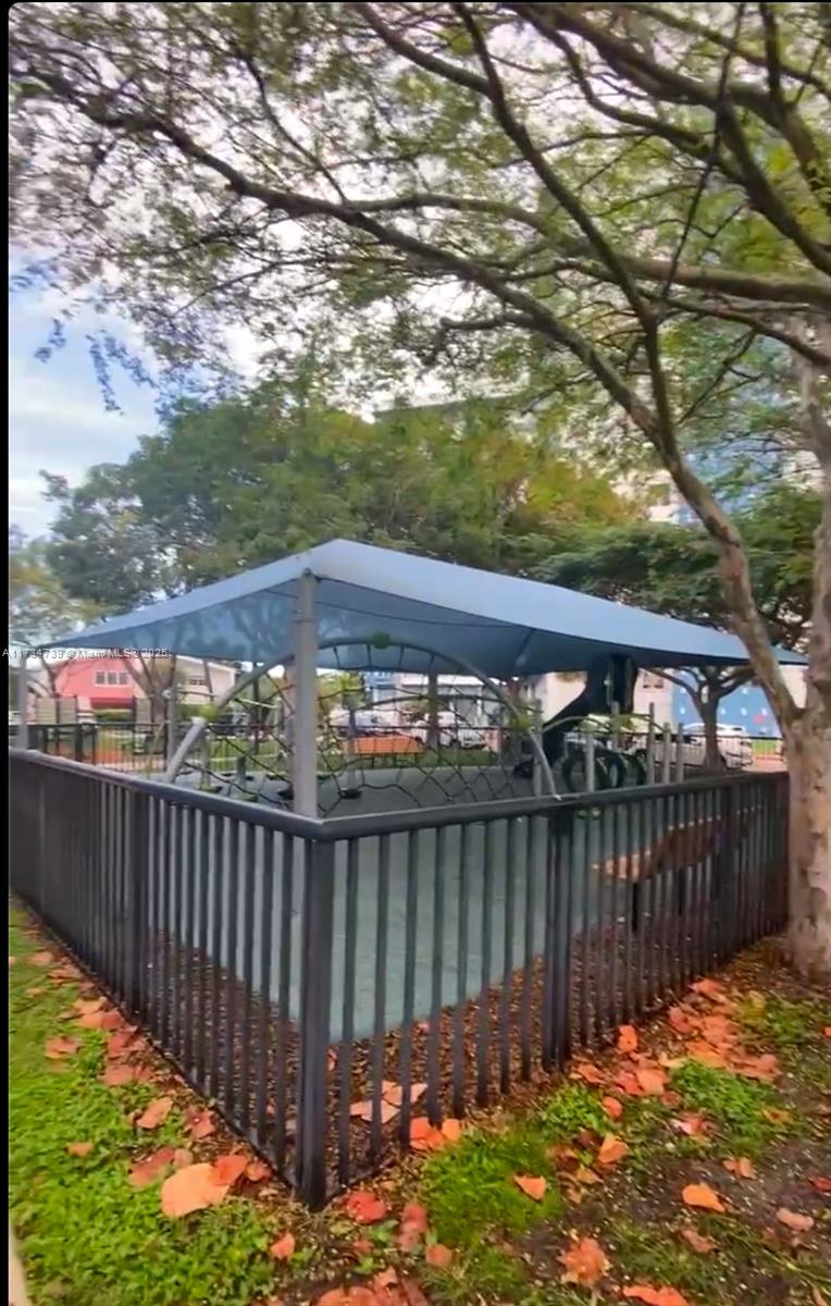 7441 Wayne Avenue, Unit 6B Miami Beach, FL 33141 - Photo 32 of 33 a view of a wooden fence