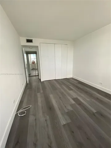 a view of a dining room with furniture and windows