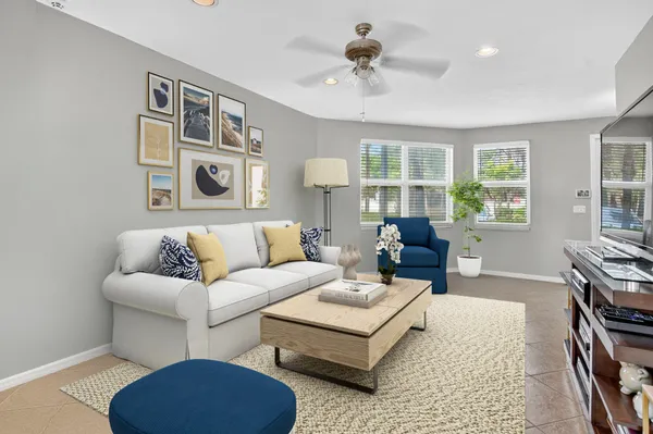 a living room with furniture rug and window