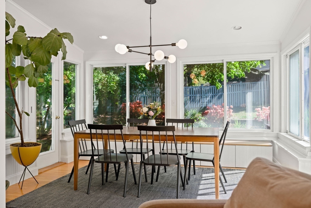 34 Avalon Road Milton, MA 02186 - Photo 26 of 42 a dining room with furniture a chandelier and a rug