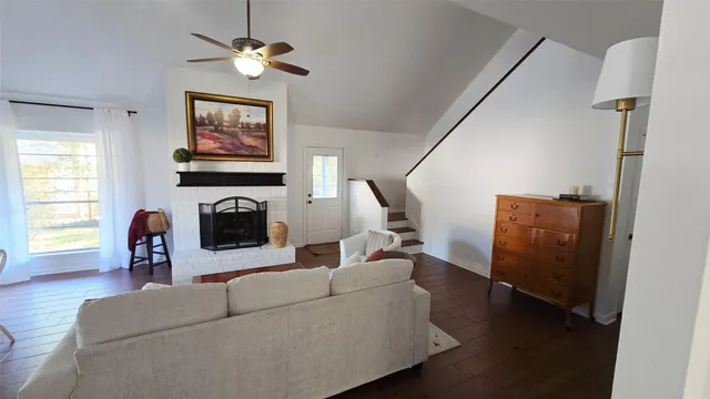 a living room with furniture and a fireplace