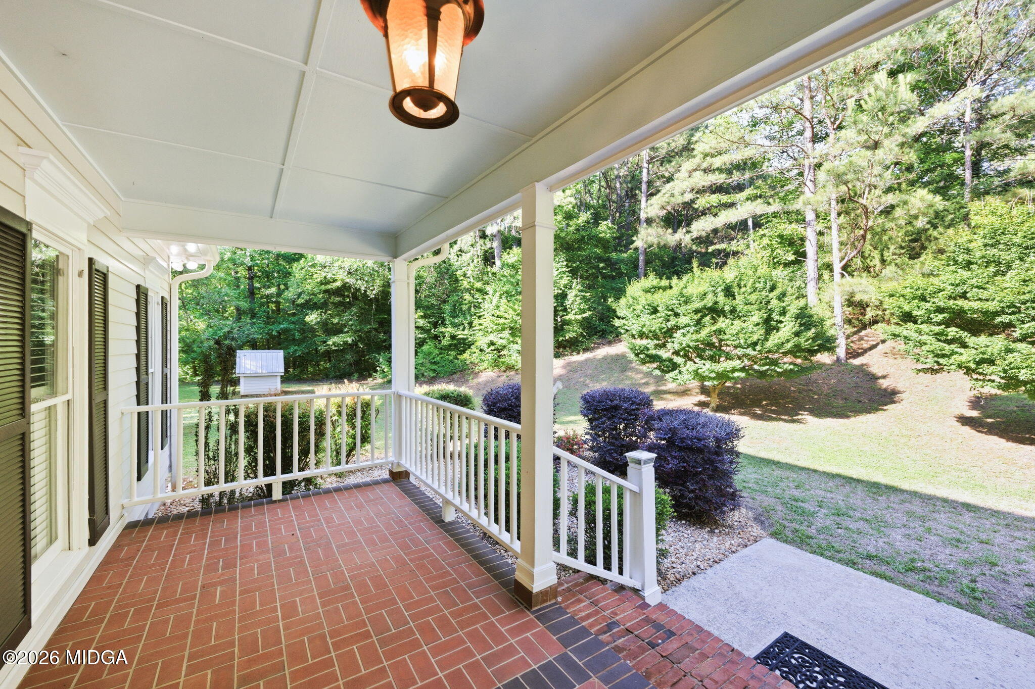 4686 Johnstonville Road Forsyth, GA 31029 - Photo 5 of 34 a porch with seating space