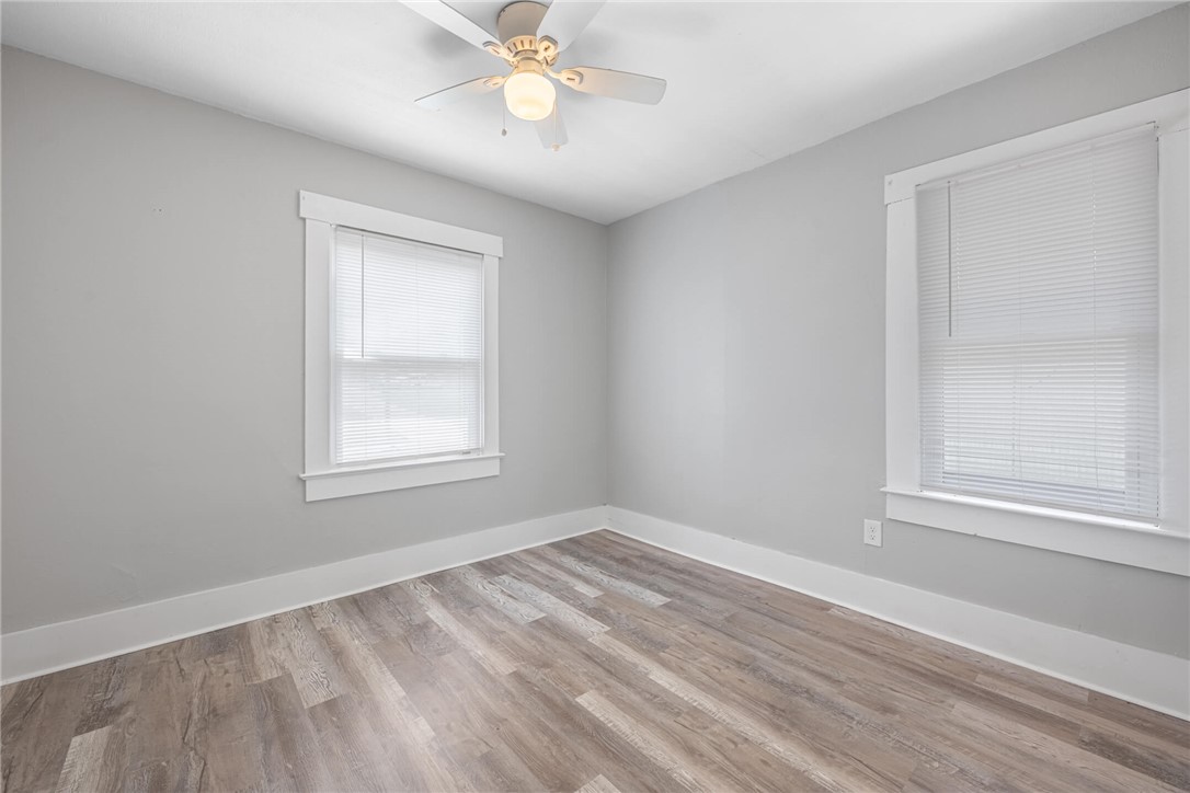 2118 Hillside Avenue Springfield, OH 45503 - Photo 11 of 28 This spacious room features ample natural light and durable flooring, offering versatile living options.