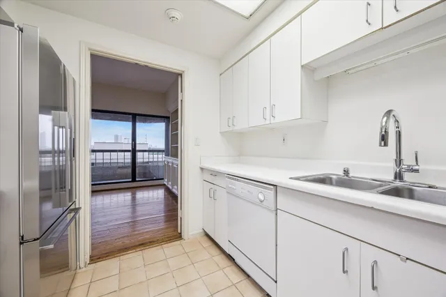 a kitchen with a sink and cabinets