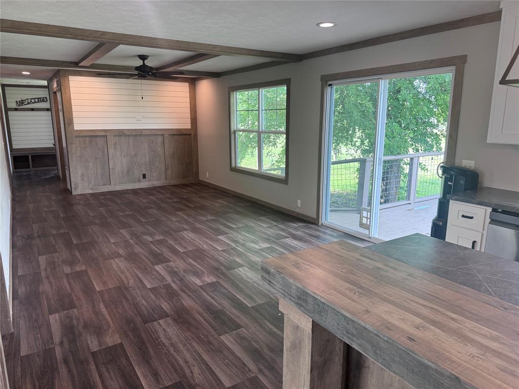 7268 Brangus Road Anna, TX 75409 - Photo 7 of 21 a view of wooden floor and brick walls