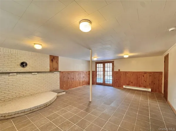 a bathroom with a mirror and a shower